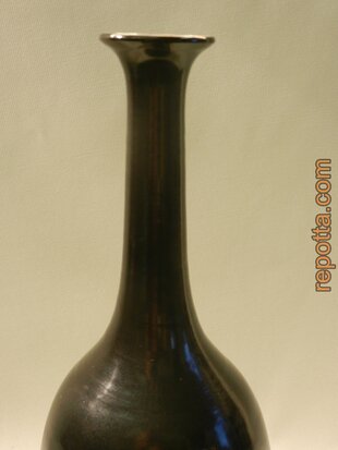 signed bottle vase with peacock on branch