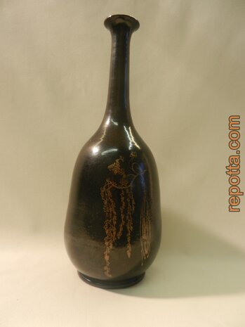 signed bottle vase with peacock on branch